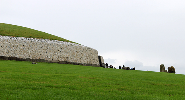 Visitors enter the passage tomb of Newgrange. Photograph ©2014 by Brian Cohen.