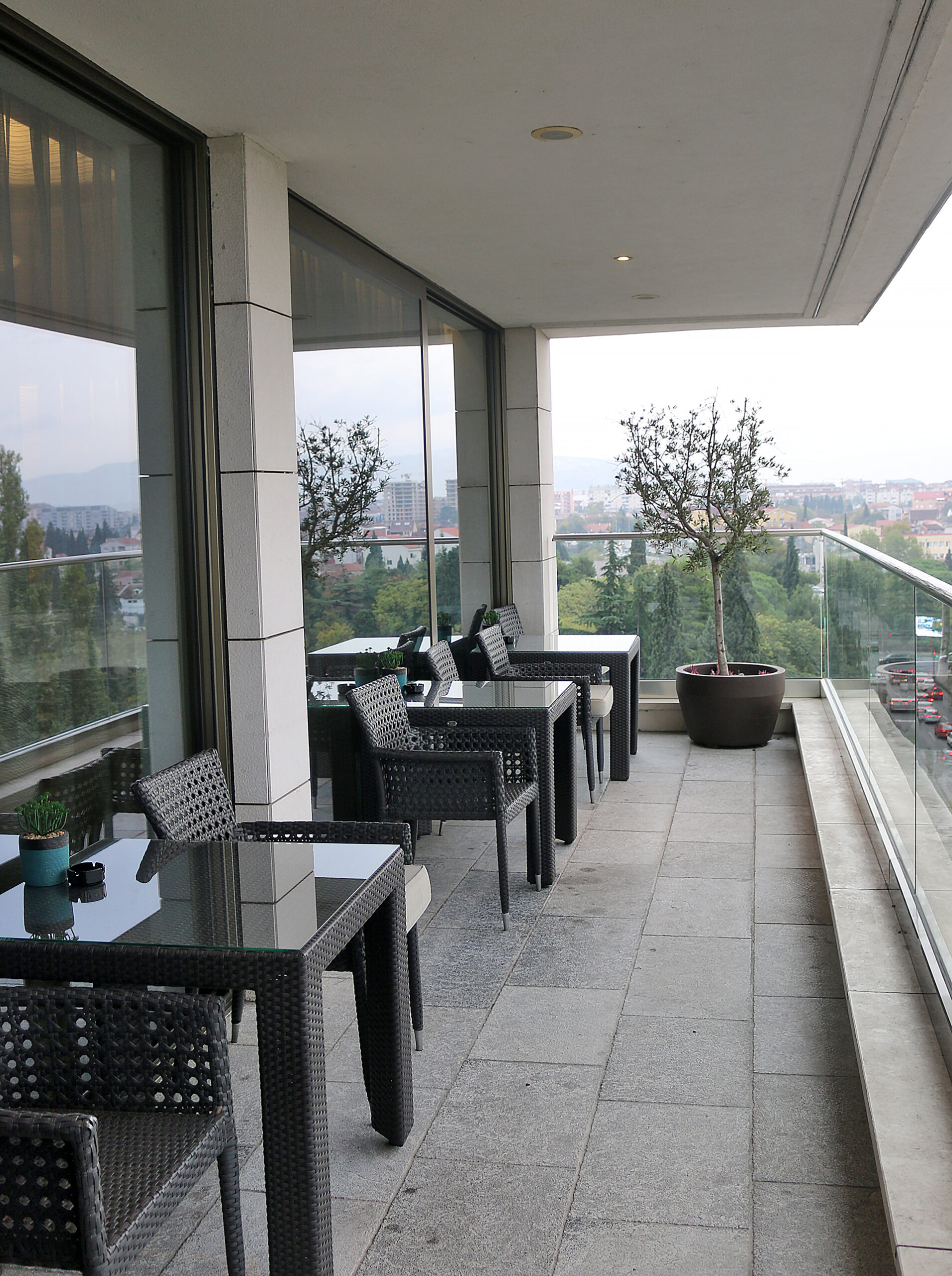 a patio with tables and chairs