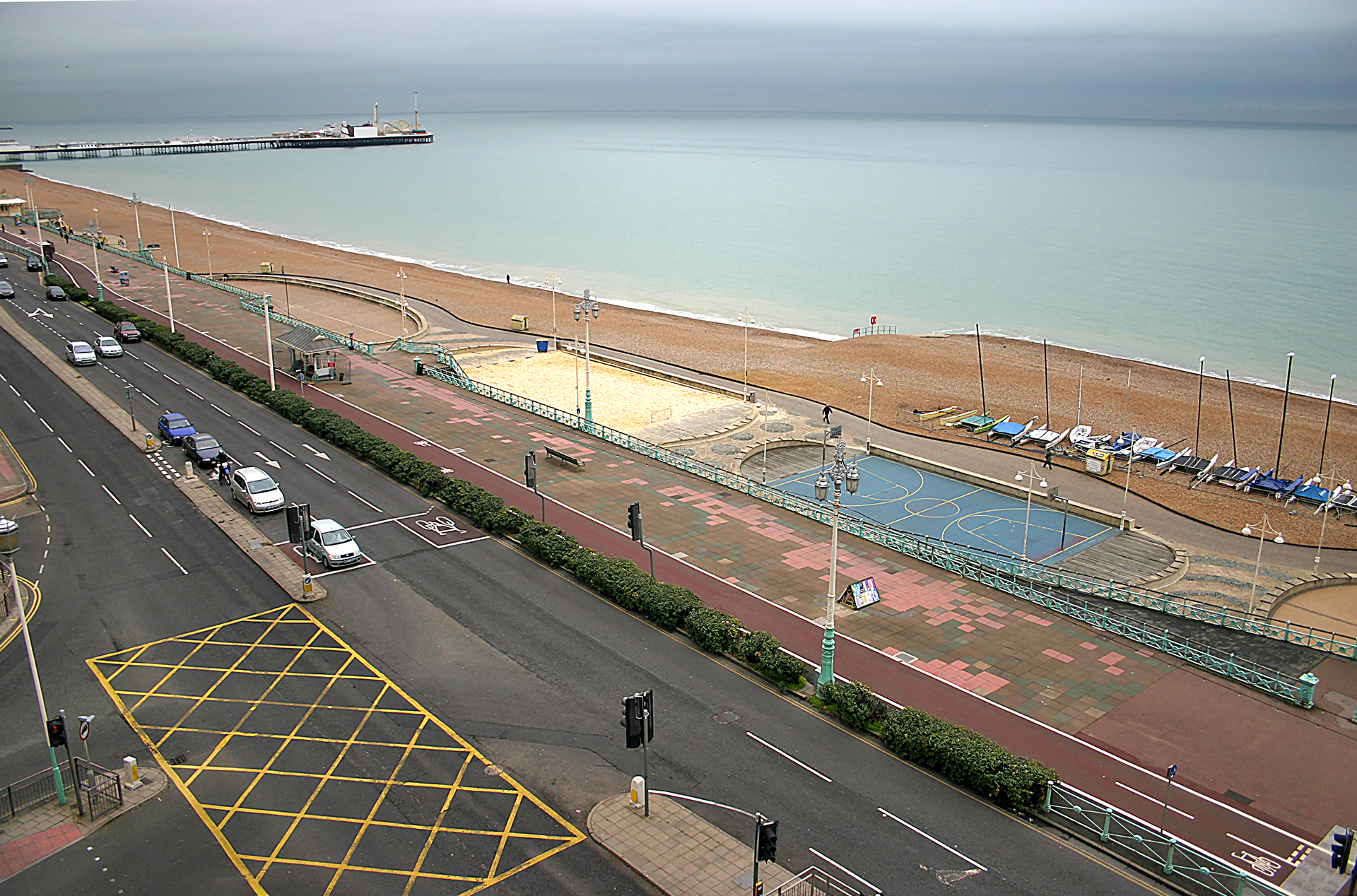 a road with a swimming pool and a beach