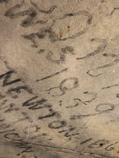 writing on a rock wall