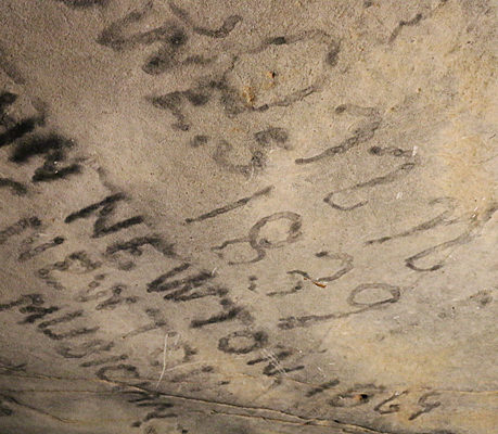 writing on a rock wall