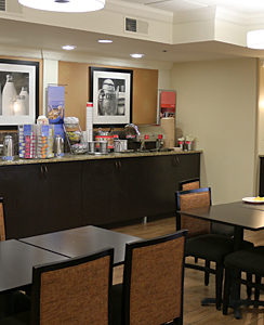 a restaurant with a buffet and tables