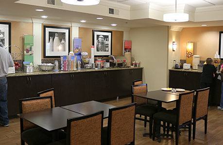 a restaurant with a buffet and tables