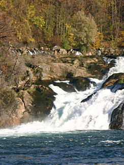 a waterfall on a rocky shore
