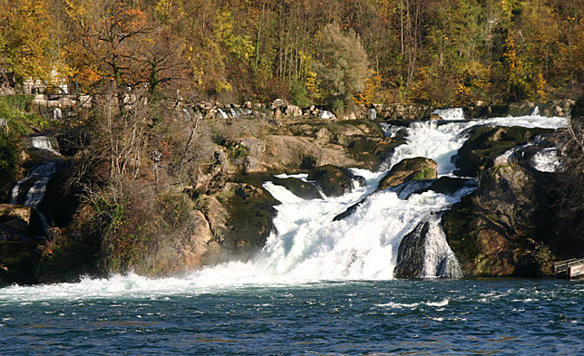 a waterfall on a rocky shore