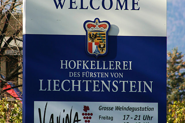 a sign with a blue and white text