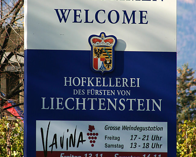 a sign with a blue and white text
