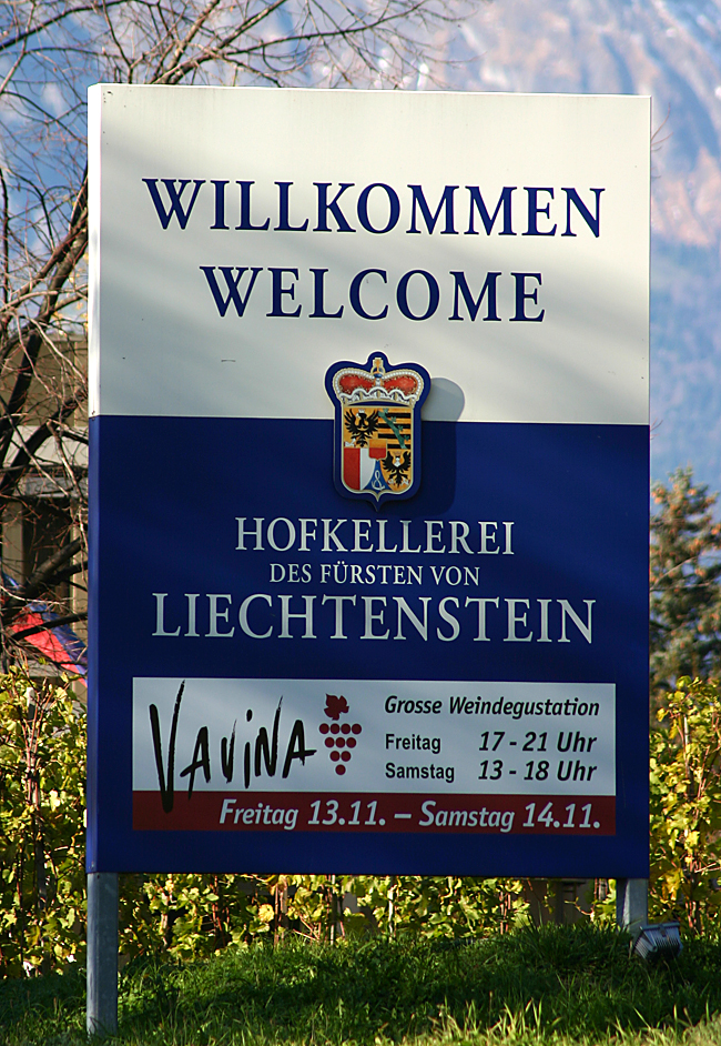 a sign with a blue and white text
