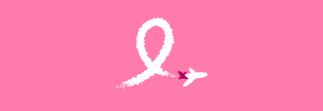 a pink ribbon with a plane flying in the sky