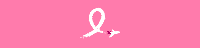 a pink ribbon with a plane flying in the sky