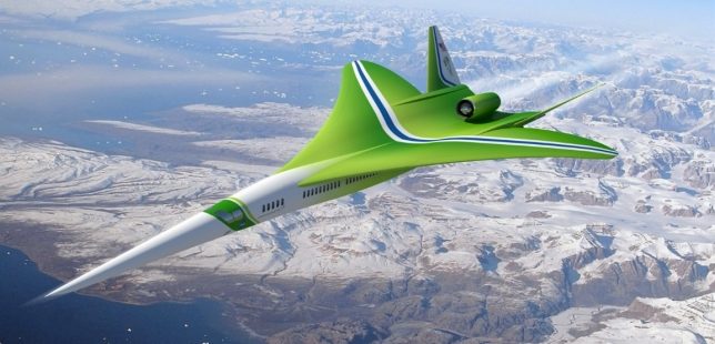 a green airplane flying over mountains