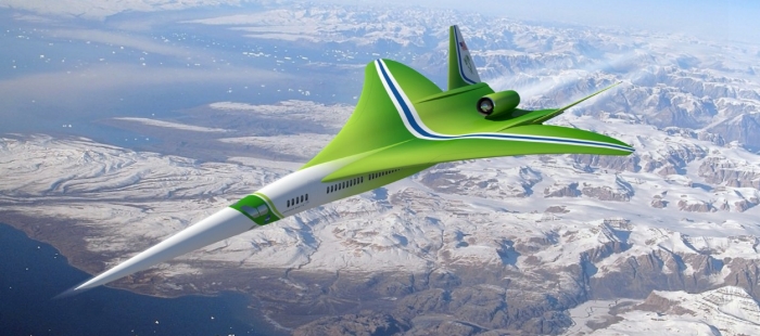 a green airplane flying over mountains