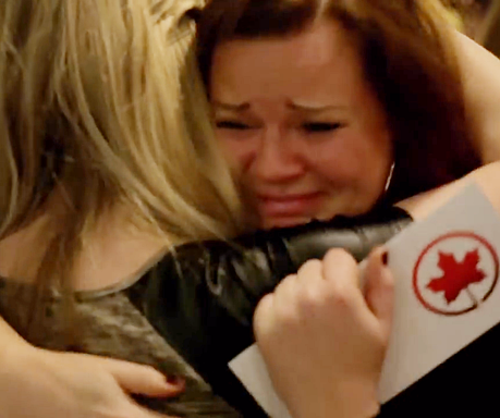 a woman hugging another woman