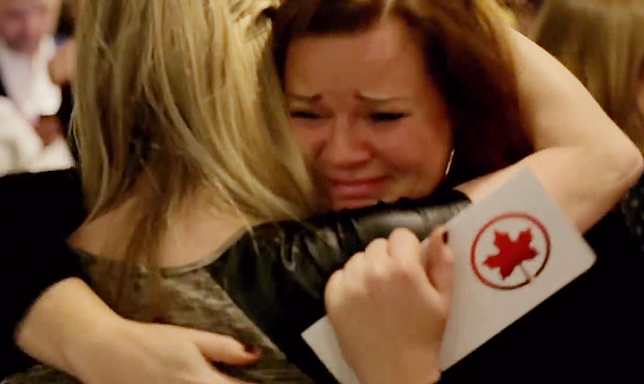 a woman hugging another woman