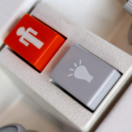 Orange flight attendant call button