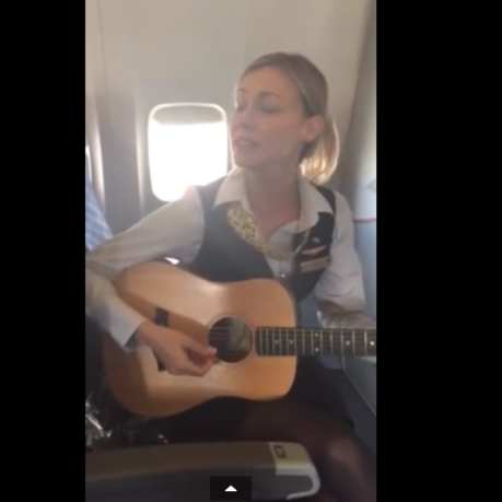 a woman playing a guitar