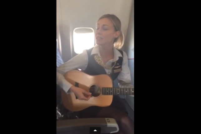 a woman playing a guitar