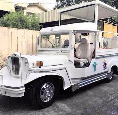 a white vehicle with a roof