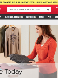 a woman holding a folded shirt