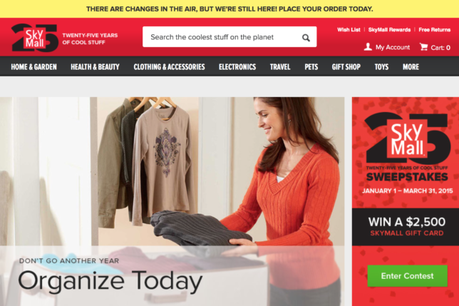 a woman holding a folded shirt