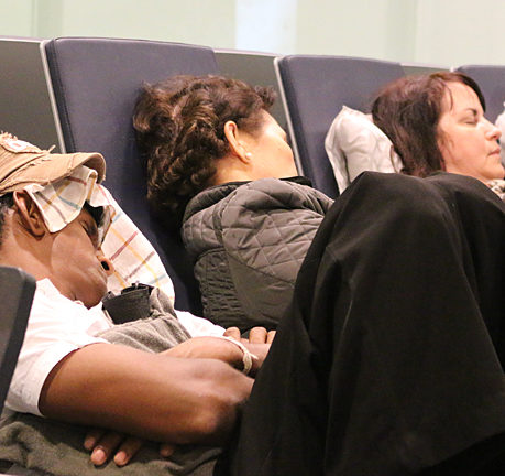 People sleeping airport Abu Dhabi