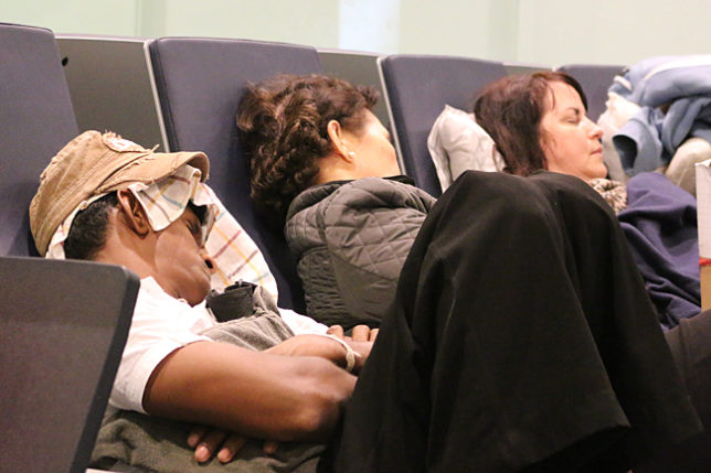 People sleeping airport Abu Dhabi