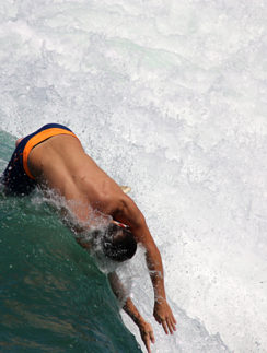 a man surfing on a wave