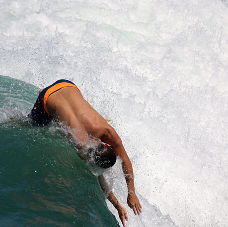 a man surfing on a wave