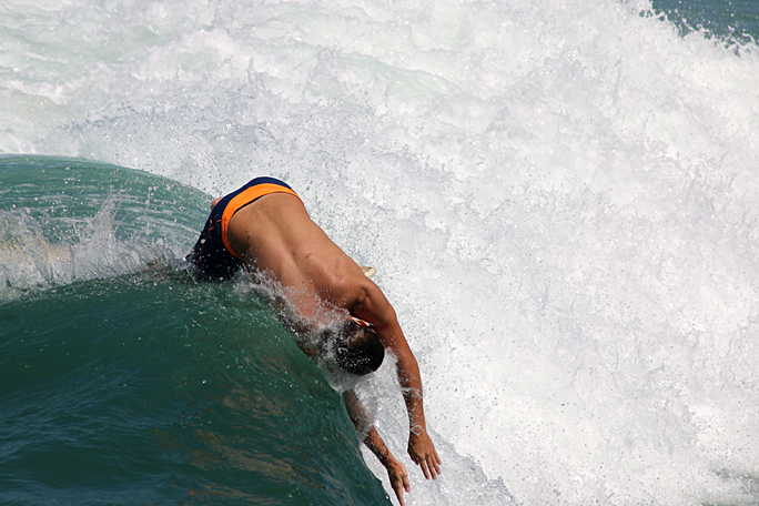 a man surfing on a wave