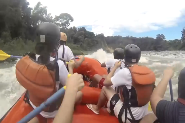 a group of people in a raft