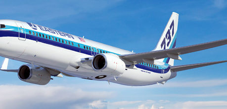 a white and blue airplane in the sky