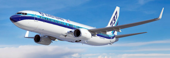 a white and blue airplane in the sky