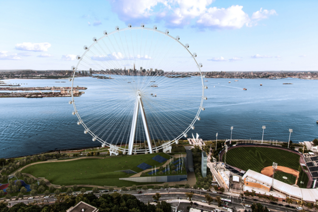 a ferris wheel next to water
