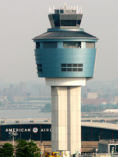 a tower with a building in the background