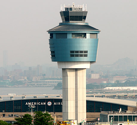a tower with a building in the background