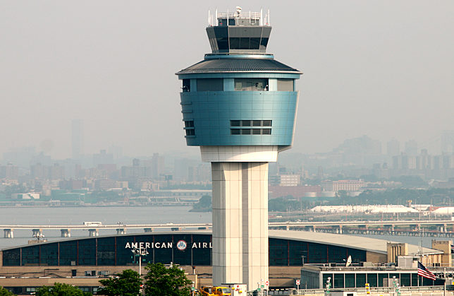 a tower with a building in the background