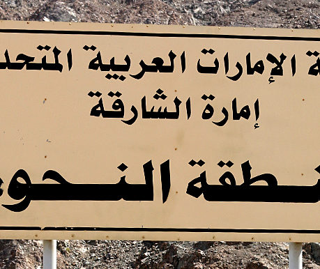 a sign with black text