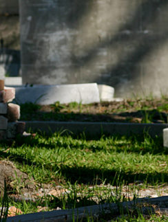 a pile of bricks and stone in a cemetery