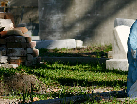 a pile of bricks and stone in a cemetery