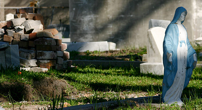 a pile of bricks and stone in a cemetery