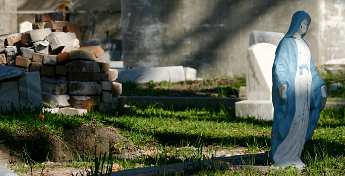 a pile of bricks and stone in a cemetery