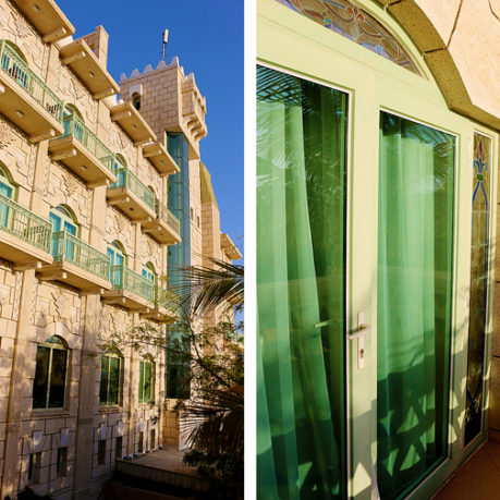 a building with a door and a balcony