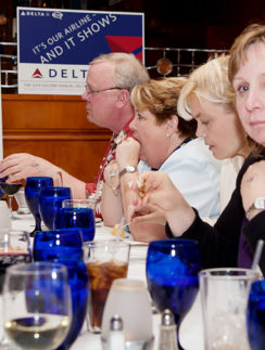 a group of people sitting at a table