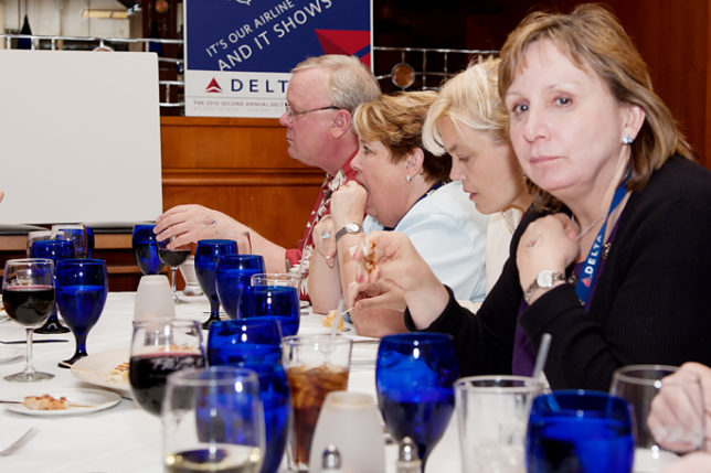 a group of people sitting at a table