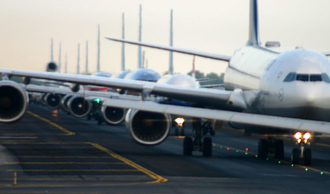 Airplanes lined up on runway