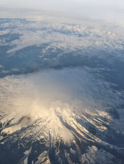 a aerial view of a mountain with snow