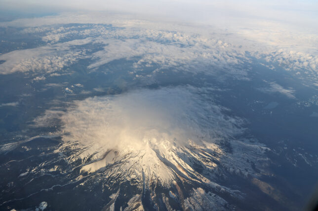 a aerial view of a mountain with snow