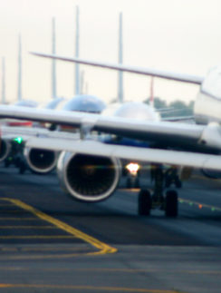Airplanes Lined Up on Runway