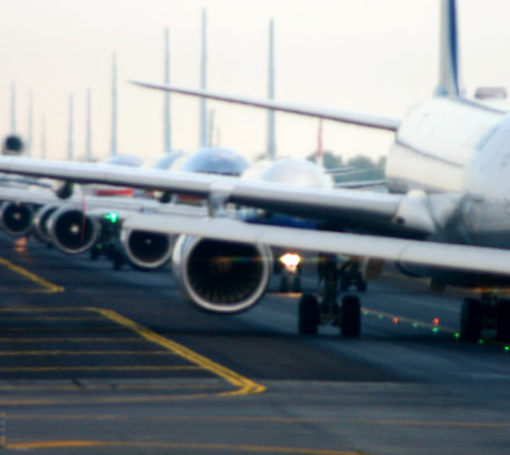 Airplanes Lined Up on Runway