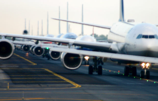 Airplanes Lined Up on Runway